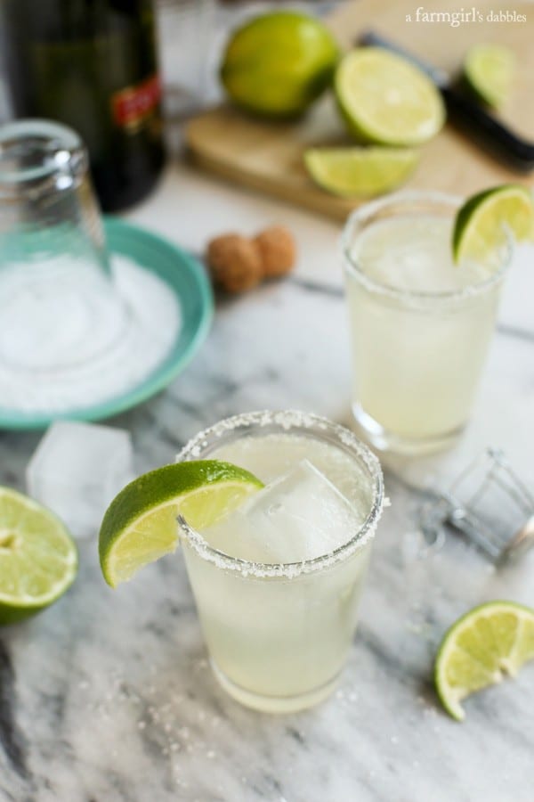 Prosecco-margaritas-big-batch-cocktail. A party isn't a party without some crowd pleasing cocktails. Save your sanity at your next party by having a few of these make-ahead big batch cocktails mixed and ready to serve. Click here to check out these delicious big batch cocktail recipes now.