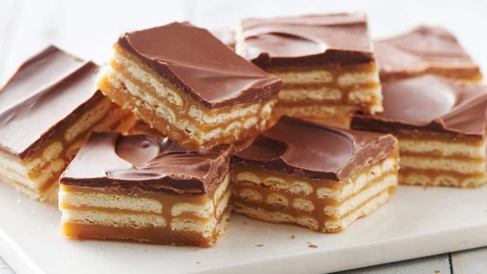 Triple Layer Cracker Toffee Bars - Check out our list of 20 of the best easy desserts to feed a crowd. Be prepared for empty dishes and a round of applause when you bring one of these recipes to your next event.