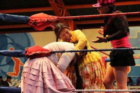 cheap place to fly and see Cholita wrestling in Bolivia