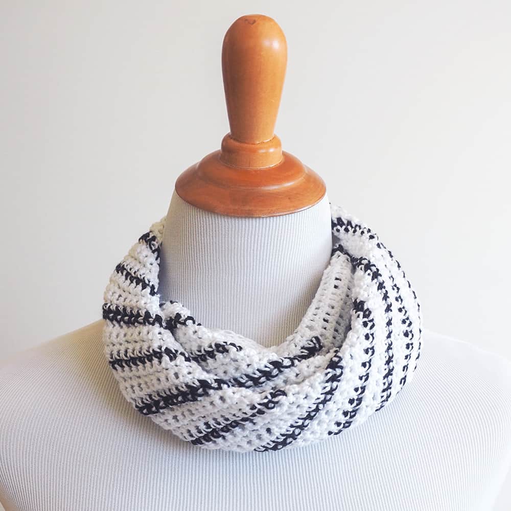 The Striped Neck Scarf is so chic and will have you daydreaming of French countrysides. #crochetscarf #crochetpattern #crochetlove #crochetaddict