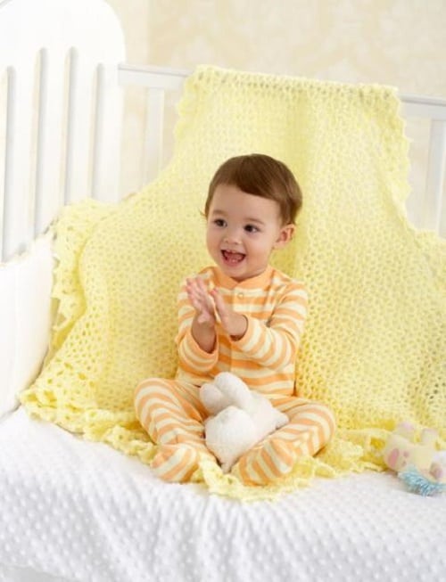 Lace Border Blanket - These lace baby blanket patterns are gentle, soft and cozy. Make a special family keepsake with one of these free crochet baby blanket patterns. #BabyBlanketCrochetPatterns #CrochetPatterns #LaceBabyBlanket #CrochetAddict