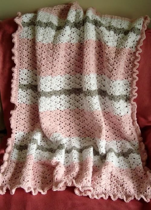 Snapdragon Baby Blanket - These lace baby blanket patterns are gentle, soft and cozy. Make a special family keepsake with one of these free crochet baby blanket patterns. #BabyBlanketCrochetPatterns #CrochetPatterns #LaceBabyBlanket #CrochetAddict