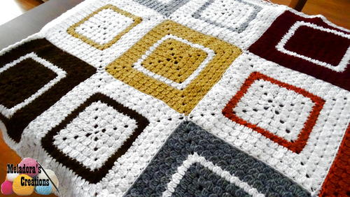 Cluster Granny Square Afghan - Crochet afghans are colorful and exciting and full of life. There’s so much room for creativity in these crochet blanket patterns. #CrochetAfghans #CrochetPatterns #CrochetBlankets