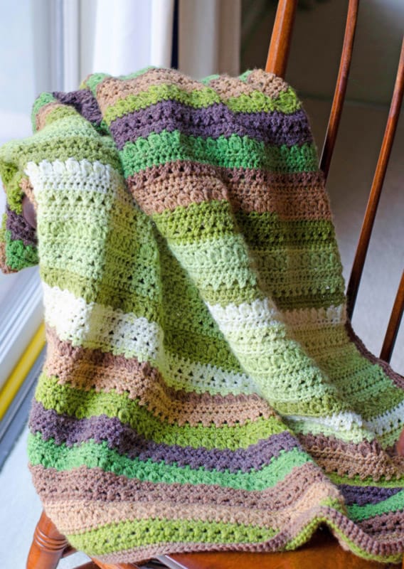 Fields and Furrows Afghan - Crochet afghans are colorful and exciting and full of life. There’s so much room for creativity in these crochet blanket patterns. #CrochetAfghans #CrochetPatterns #CrochetBlankets