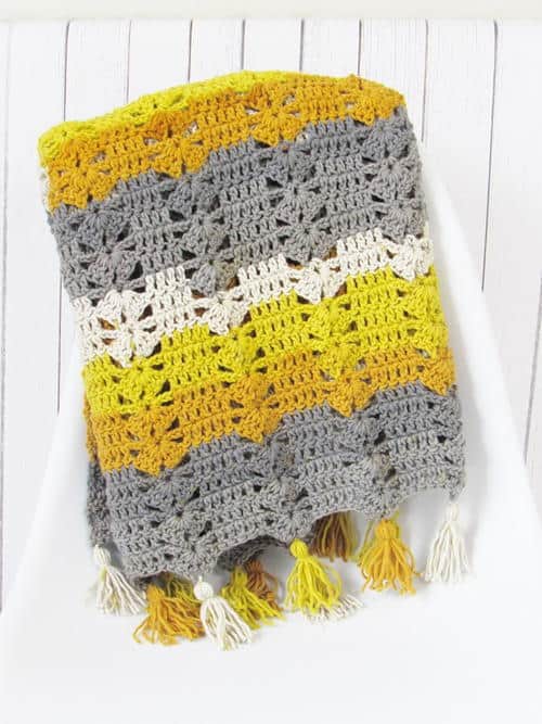 Fireplace Afghan - Crochet afghans are colorful and exciting and full of life. There’s so much room for creativity in these crochet blanket patterns. #CrochetAfghans #CrochetPatterns #CrochetBlankets