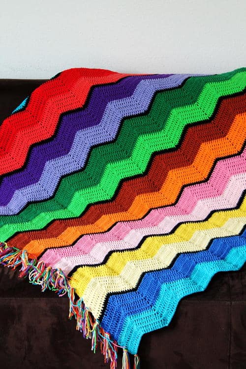 Retro Ripple Afghan - Crochet afghans are colorful and exciting and full of life. There’s so much room for creativity in these crochet blanket patterns. #CrochetAfghans #CrochetPatterns #CrochetBlankets