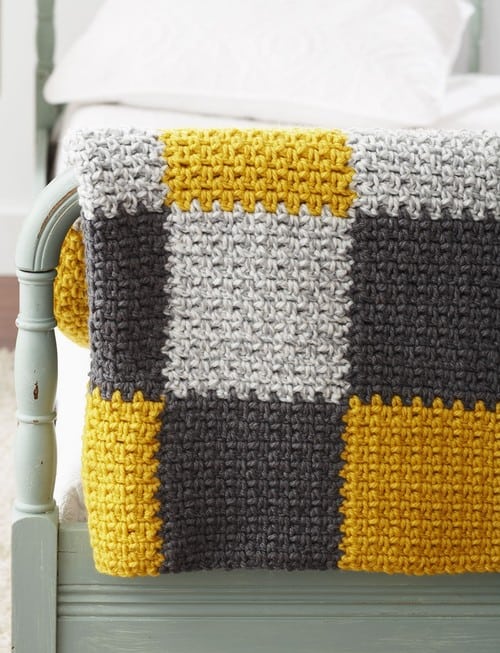 Stellar Patchwork Blanket - Crochet afghans are colorful and exciting and full of life. There’s so much room for creativity in these crochet blanket patterns. #CrochetAfghans #CrochetPatterns #CrochetBlankets
