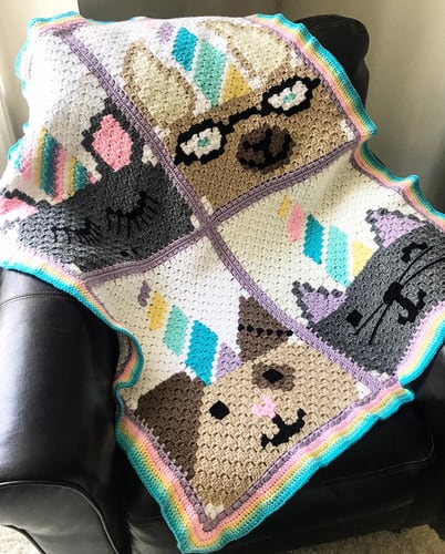 Unicorn Character Afghan - Crochet afghans are colorful and exciting and full of life. There’s so much room for creativity in these crochet blanket patterns. #CrochetAfghans #CrochetPatterns #CrochetBlankets