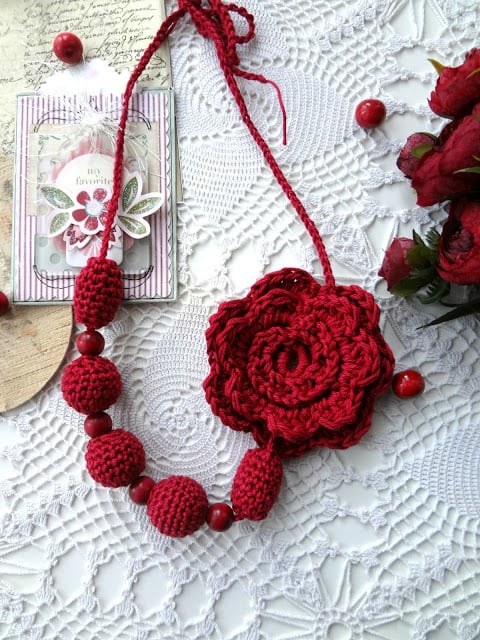 Flower Rosette & Bead Necklace - Learn how to crochet a flower and bring the magic of nature into your life with these crochet patterns.  Each one is unique and colorful. #CrochetFlowerPatterns #CrochetPatterns #FreeCrochetPatterns