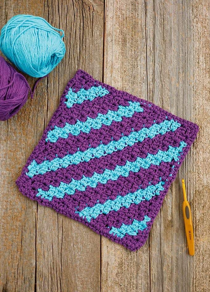 Mini C2C Stripe Dishcloth - These crochet dishcloth patterns are all free and are so different from each other. Test your creativity with one of these brilliant dishcloth patterns. #CrochetDishclothPatterns #CrochetPatterns #DishclothPatterns