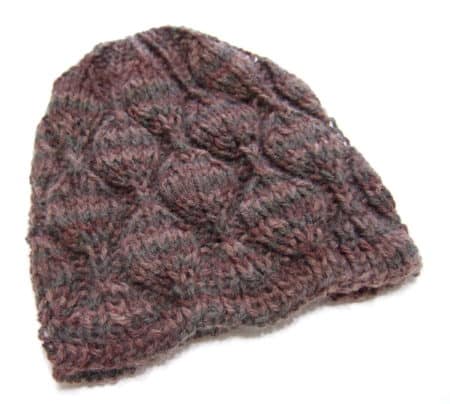 Embossed Leaves Hat - These 23 easy knitting patterns for hats are a perfect starting place for beginners, and they’re fun to do for even seasoned knitters. #knittingpatterns #knithatpatterns