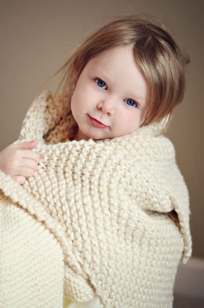 Garter Stitch Blanket - These knitting patterns for baby blankets are easy and adorable you might find yourself making more than just one! #knittingpatterns #babyblanketknittingpatterns #babyblankets