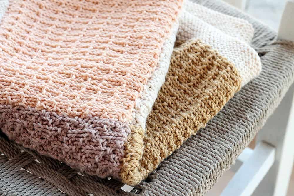 Knitted Baby Blanket - These knitting patterns for baby blankets are easy and adorable you might find yourself making more than just one! #knittingpatterns #babyblanketknittingpatterns #babyblankets