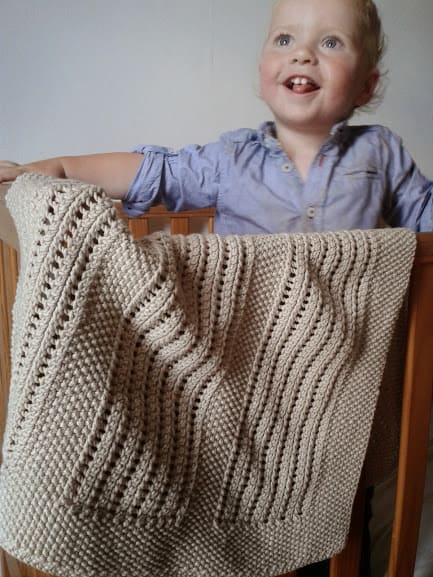 Moss and Lace Rib Baby Blanket - These knitting patterns for baby blankets are easy and adorable you might find yourself making more than just one! #knittingpatterns #babyblanketknittingpatterns #babyblankets