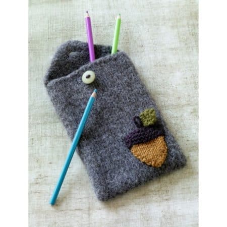 Felted Acorn Pencil Case - We’ve got 16 quick and easy Thanksgiving knitting patterns for anything from hats, to centerpiece decorations. #knittingpatterns #thanksgivingknittingpatterns #freeknittingpatterns