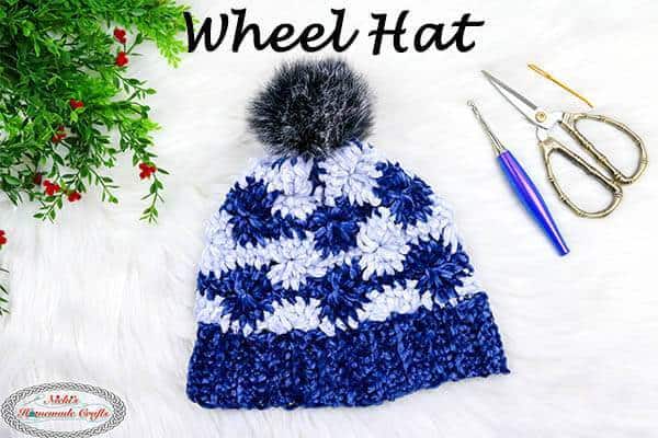 Wheel Hat - These 26 crochet winter hat patterns are perfect to create a winter hat accessory that you love and can rely on. #crochetwinterhat #crochetpatterns #crochethatpatterns