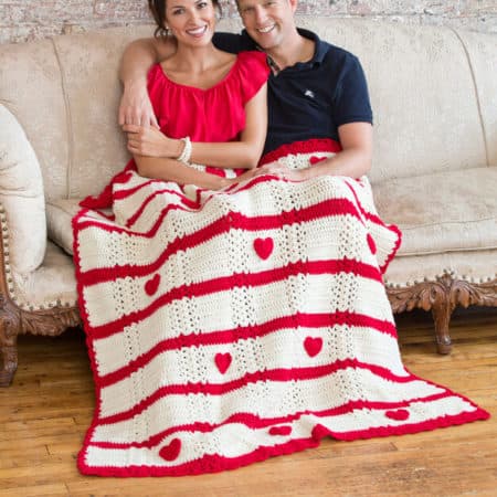 Be My Valentine Throw - Check out this list of ‘love’-ly easy crochet projects you can do for the ones you love. These range from easy trinkets, wreaths and blankets. #EasyCrochetProjects #CrochetPatterns #ValentineCrochetPatterns