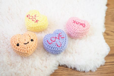 Candy Conversation Hearts Keychains - Check out this list of ‘love’-ly easy crochet projects you can do for the ones you love. These range from easy trinkets, wreaths and blankets. #EasyCrochetProjects #CrochetPatterns #ValentineCrochetPatterns
