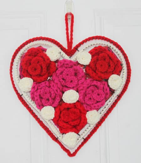 Crochet Valentine’s Rose Heart Wreath - Check out this list of ‘love’-ly easy crochet projects you can do for the ones you love. These range from easy trinkets, wreaths and blankets. #EasyCrochetProjects #CrochetPatterns #ValentineCrochetPatterns