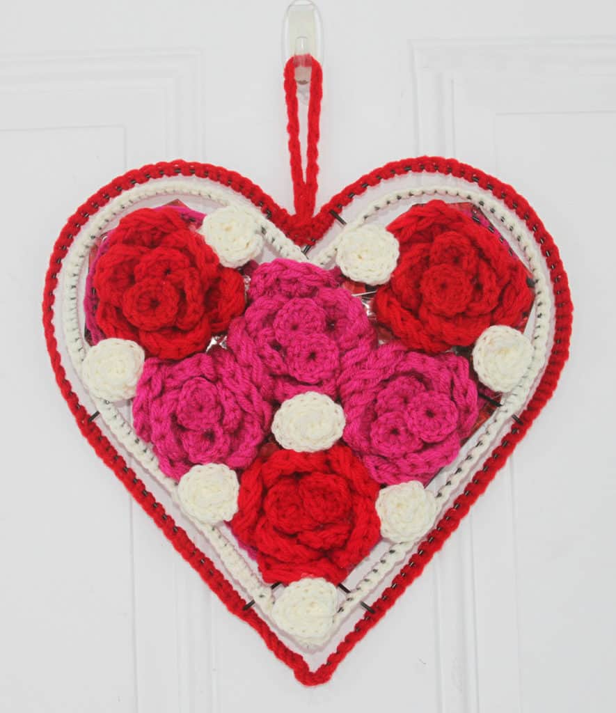 Crochet Valentine’s Rose Heart Wreath - Check out this list of ‘love’-ly easy crochet projects you can do for the ones you love. These range from easy trinkets, wreaths and blankets. #EasyCrochetProjects #CrochetPatterns #ValentineCrochetPatterns