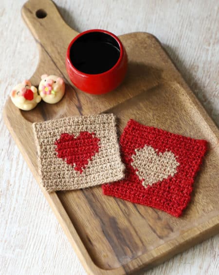 Valentine Heart Coasters - Check out this list of ‘love’-ly easy crochet projects you can do for the ones you love. These range from easy trinkets, wreaths and blankets. #EasyCrochetProjects #CrochetPatterns #ValentineCrochetPatterns