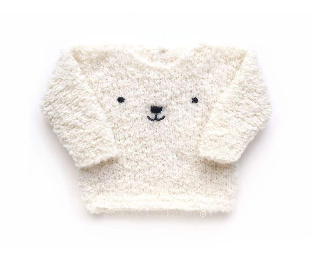 Teddy Bear Sweater - Keep yourself warm and comfy this season by knitting one of these knitted sweater patterns. You can choose from the basic pullover to a more daring design. #knittedsweaterpatterns #knittingpatterns #knitsweaterpatterns