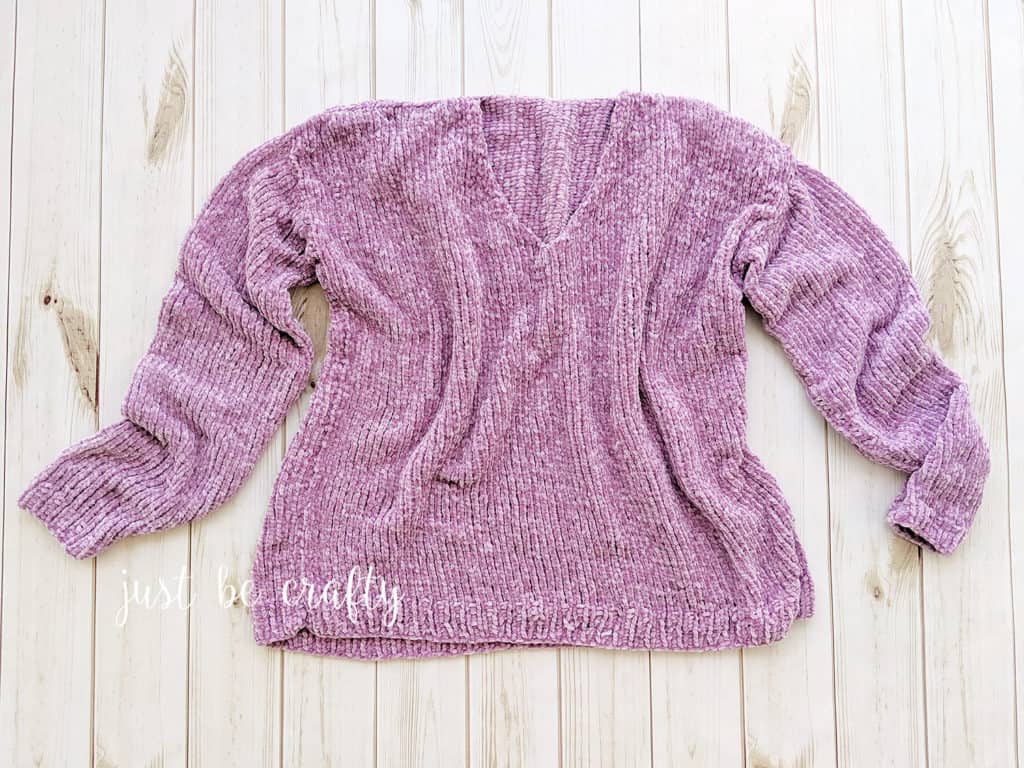 Velvet Slouchy V-Neck Knit Sweater - Keep yourself warm and comfy this season by knitting one of these knitted sweater patterns. You can choose from the basic pullover to a more daring design. #knittedsweaterpatterns #knittingpatterns #knitsweaterpatterns