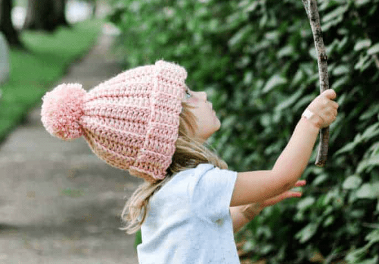 Girl wearing crochet beanie hat
