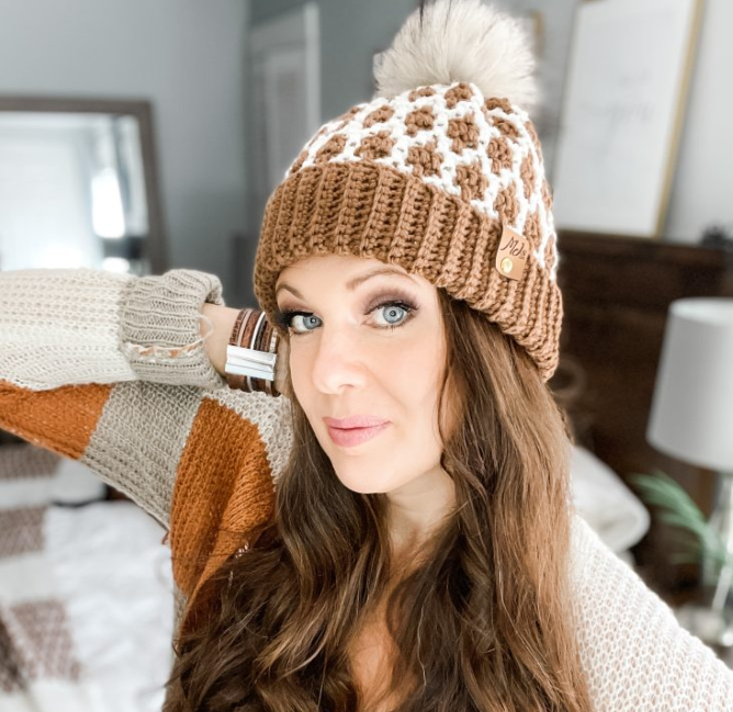 Woman wearing mosaic crochet beanie hat