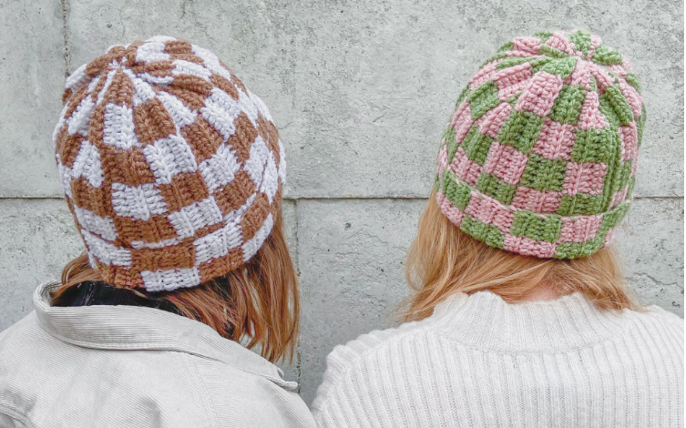 Two women wearing crochet ribbed checker beanie hat