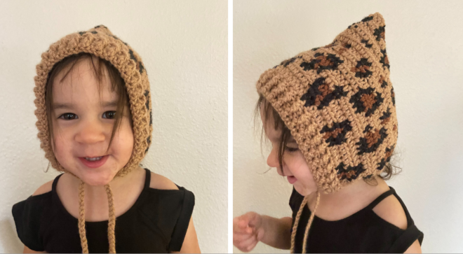 Baby girl wearing a luxe leopard bonnet