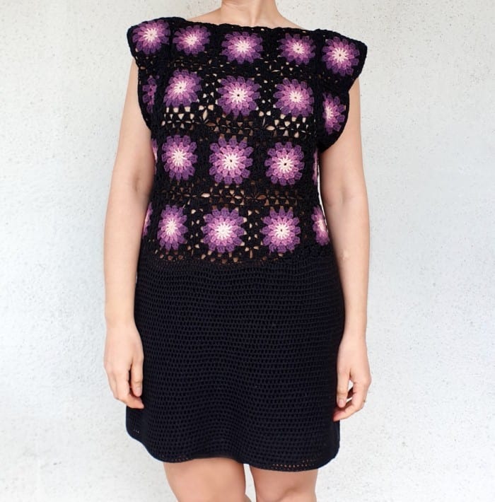 woman wearing a crochet dress with granny squares bodice