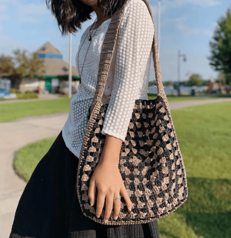 A woman wearing a Crochet Granny Square Bag