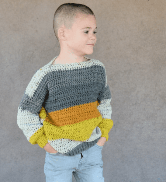 Girl wearing crochet sweater pattern