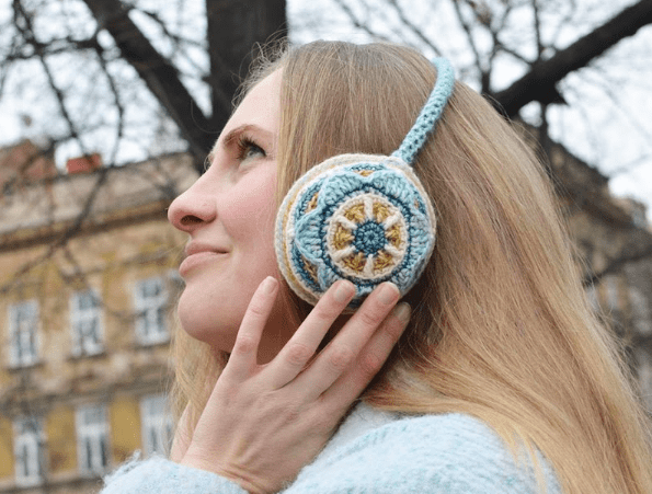 Woman wearing earmuffs crochet