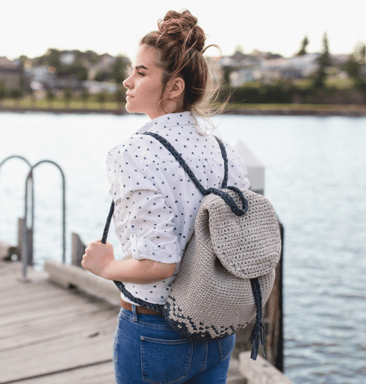 a girl wearing the Florence Crochet Backpack