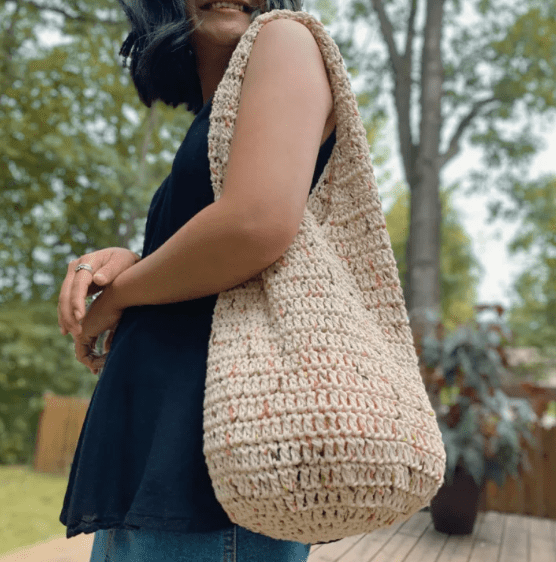 A woman wearing a Crochet Tote Bag 