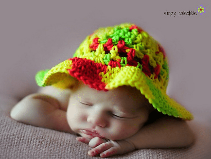 A new born wearing the Coraline’s Crochet Sun Hat