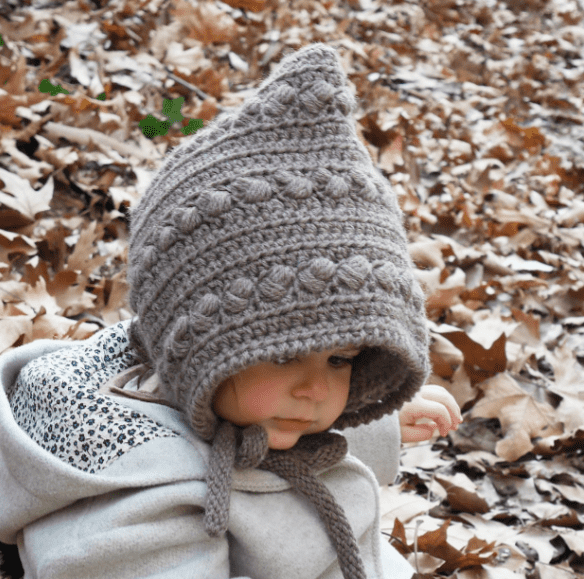 A kid wearing a Crochet Pixie Hat