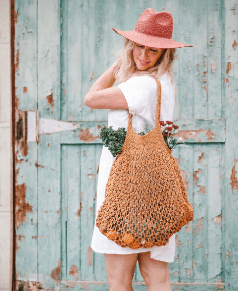 woman wearing hat with a Crochet Market Tote Bag