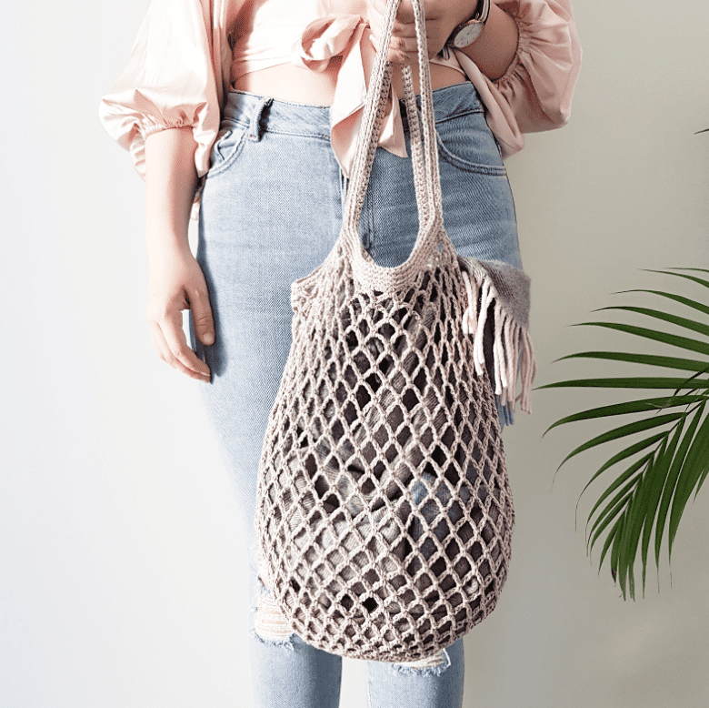 someone holding the Rustic Crochet Market Bag