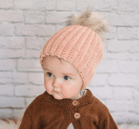 A baby wearing a crochet hat